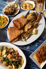 Traditional Lebanese mezze with assorted fried fish and classic sides.