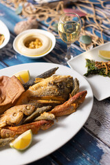 Lebanese seafood platter with sides, served on styled mezze table.