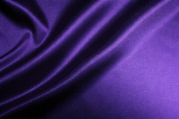 Fototapeta premium Elegant violet silk drapes softly, catching light and shadow across its luxurious folds