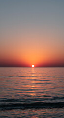 Fototapeta premium Serene Sunset over Calm Ocean Waters Vibrant Sky and Golden Hour Glow