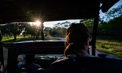 woman in a safara jeep in yala national park, sri lanka