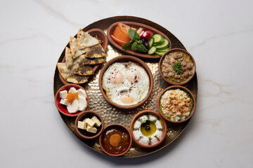 Traditional Lebanese breakfast served on brass tray.