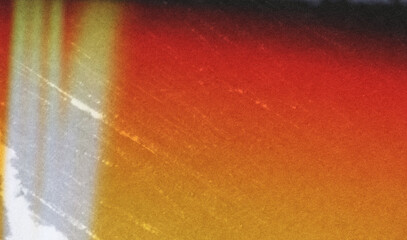 grainy colorful warm orange light leaks on black background with dust texture. abstract damaged...