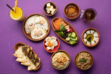 Traditional Lebanese breakfast spread with eggs, mezze, and fresh juice.
