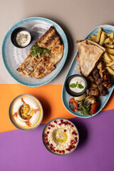 Traditional Lebanese mezze and grill platter with colorful, vibrant presentation.
