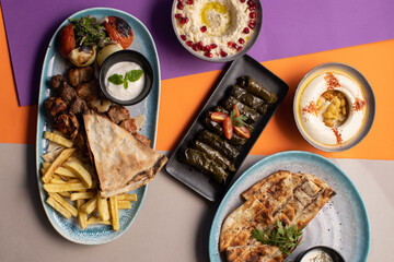 Traditional Lebanese mezze and grill platter with colorful, vibrant presentation.