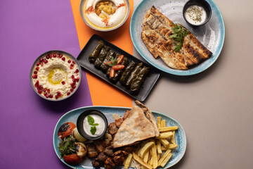 Traditional Lebanese mezze and grill platter with colorful, vibrant presentation.