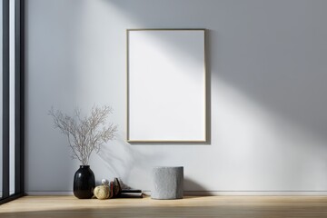 Blank framed picture on a light gray wall.