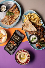 Traditional Lebanese mezze and grill platter with colorful, vibrant presentation.