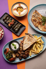 Traditional Lebanese mezze and grill platter with colorful, vibrant presentation.
