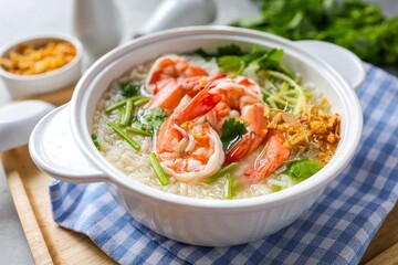 Rice porridge with shrimp ,homemade rice soup with shrimp in a white bowl	