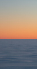 Fototapeta premium Serene Sunset Over Calm Ocean Tranquil Coastal Landscape at Dusk