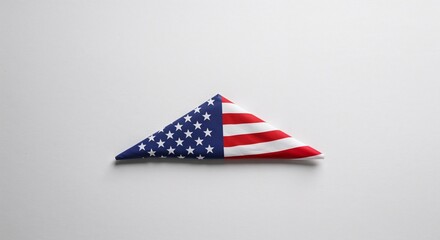 Folded American flag on white background