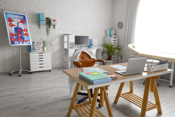 Interior of medical office with desks, plants and couch