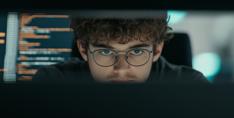 Male software developer working with code overlay, close-up background