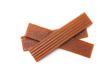 Pieces of delicious fruit leather on white background, top view