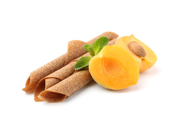Tasty fruit leather rolls, apricot and mint isolated on white