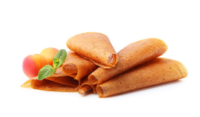 Delicious fruit leather rolls and apricots isolated on white