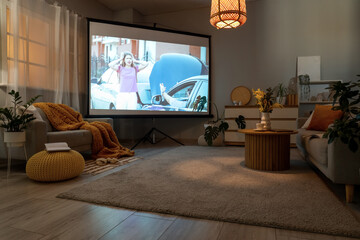 Interior of stylish living room with grey sofa, coffee table and modern projector screen