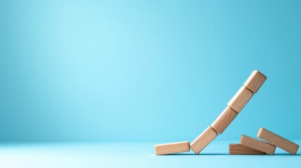 A series of wooden blocks are stacked in a gently ascending order against a light blue background, symbolizing growth, stability, and creativity in a minimalistic approach.
