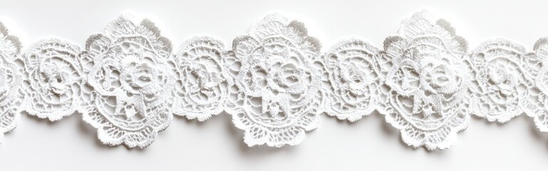Decorative white lace trim with floral motifs
