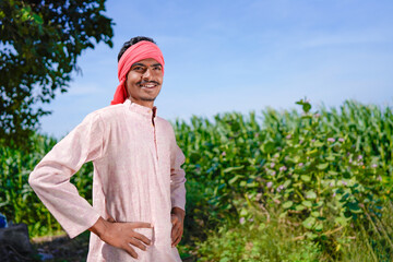 Fototapeta premium indian farmer standing confidently at agriculture field
