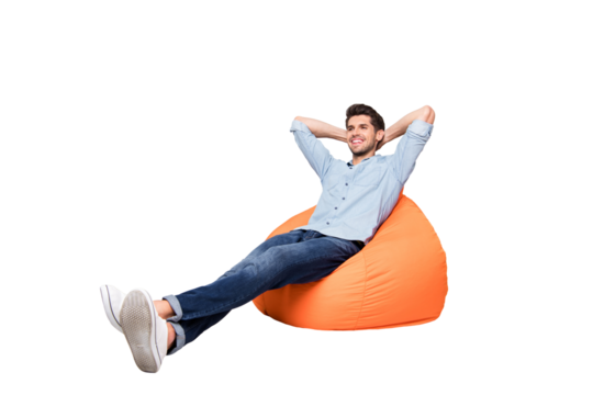 Turned full length body size photo of cheerful confident relaxing man sitting in chair thinking guessing smiling toothily having rest fun isolated over grey color background
