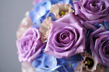 A gorgeous collection of lavender roses and blue hydrangeas, blooming with natural beauty.