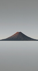 Fototapeta premium Majestic Volcanic Mountain Landscape Sunrise Over a Conical Peak