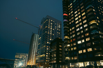 Fototapeta premium Low angle view of modern buildings during night