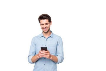 Portrait of positive cheerful man stand copyspace have fun use his smartphone type new post in blog enjoy feel content wear style clothes isolated over grey color background
