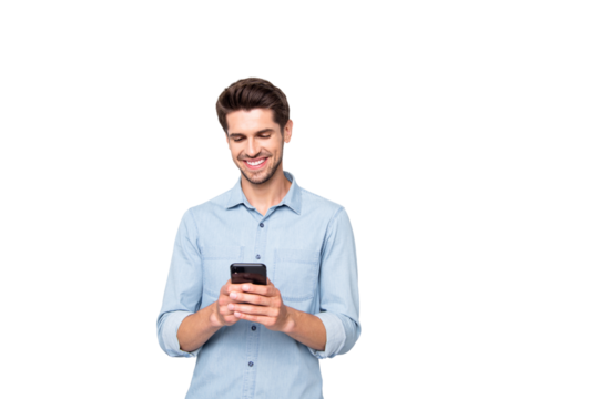 Portrait of positive cheerful man stand copyspace have fun use his smartphone type new post in blog enjoy feel content wear style clothes isolated over grey color background