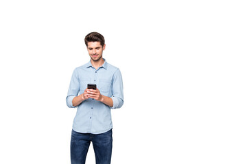 Portrait of charming focused man stand copyspace using cellphone type message to his online friends in social network account wear style clothes isolated over grey color background