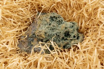 Orbicular or ocean jasper stone, macroshooting of natural mineral rock specimen - on beige...