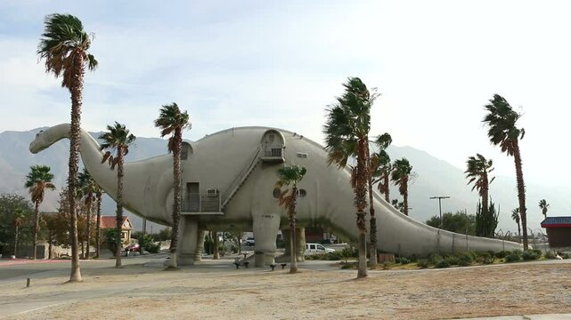 Large dinosaur sculptures, famous roadside tourist attraction along highway interstate 10 in Cabazon, California. Brontosaurus.