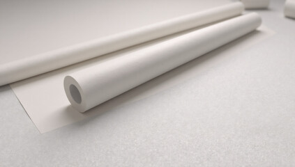 White paper rolls on textured surface for design mockup