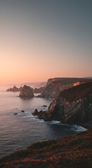 Dramatic Coastal Cliffs at Sunset Ocean Waves Crashing Rocky Shoreline Nature Landscape Photography