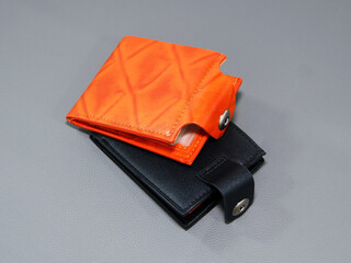 Leather wallets together on grey background close-up view,   Wallets on leather background closeup...