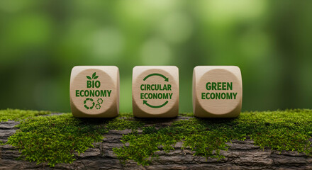 Eco-friendly wooden blocks with the terms "Bio Economy", "Circular Economy", and "Green Economy"