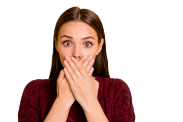 Close up photo of girl with her mouth covered with hands while isolated with yellow background keeping silence