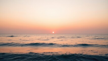 Naklejka premium Pink and Orange Sunrise over Tranquil Ocean