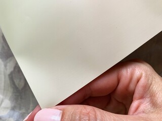 Beige vintage paper in womans hand for notes. Busines notes background, Greeting card with copy space. free space for your text. 