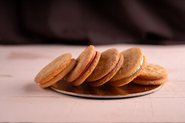 photo, presentation, decoration, baked, cream, layer, feature, dessert, sweet, texture, pattern, taste, collection, sandwich, icing, cookie, round, color, filling, pink, purple, white, display