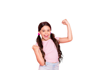 Portrait of cheerful girl raising fists screaming yeah wearing white t-shirt isolated over pink...