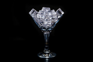 ice cubes on glass with black background closeup view