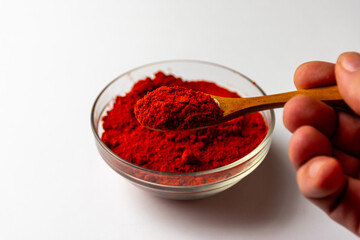 Hungarian red paprika and wooden spoon