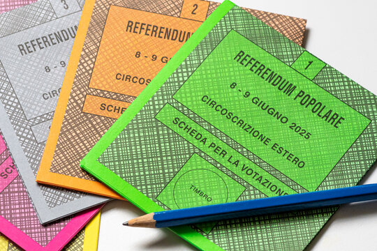 Colored ballot slips for the five questions of 2025 Italian popular referendum, officially Abrogative Referendums in Italy, with pencil on a white background