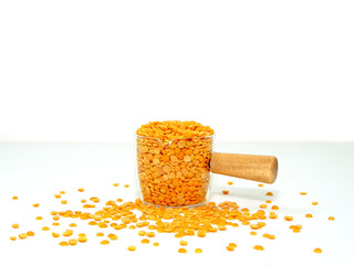 lentils on glass jar isolated on white background closeup view 