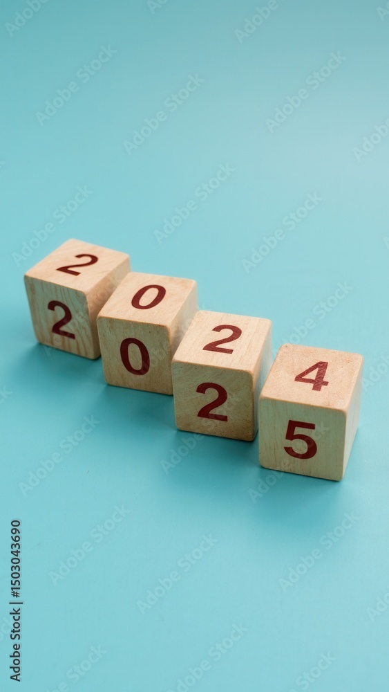 Poster transitioning from 2024 to 2025 with wooden blocks symbolizing target business for the year. this re