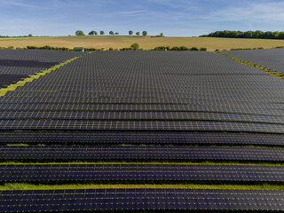 Aerial View of Large Solar Farm on Rolling Hills Near Bitburg, Germany